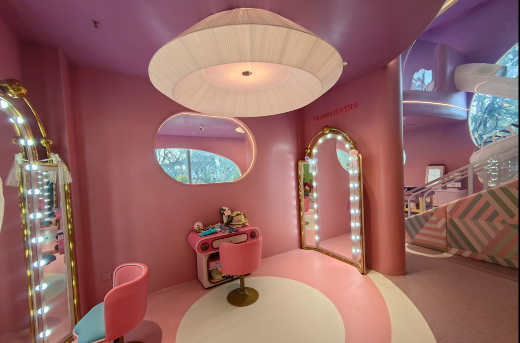 Pastel children play interior with curved windows and integrated lighting