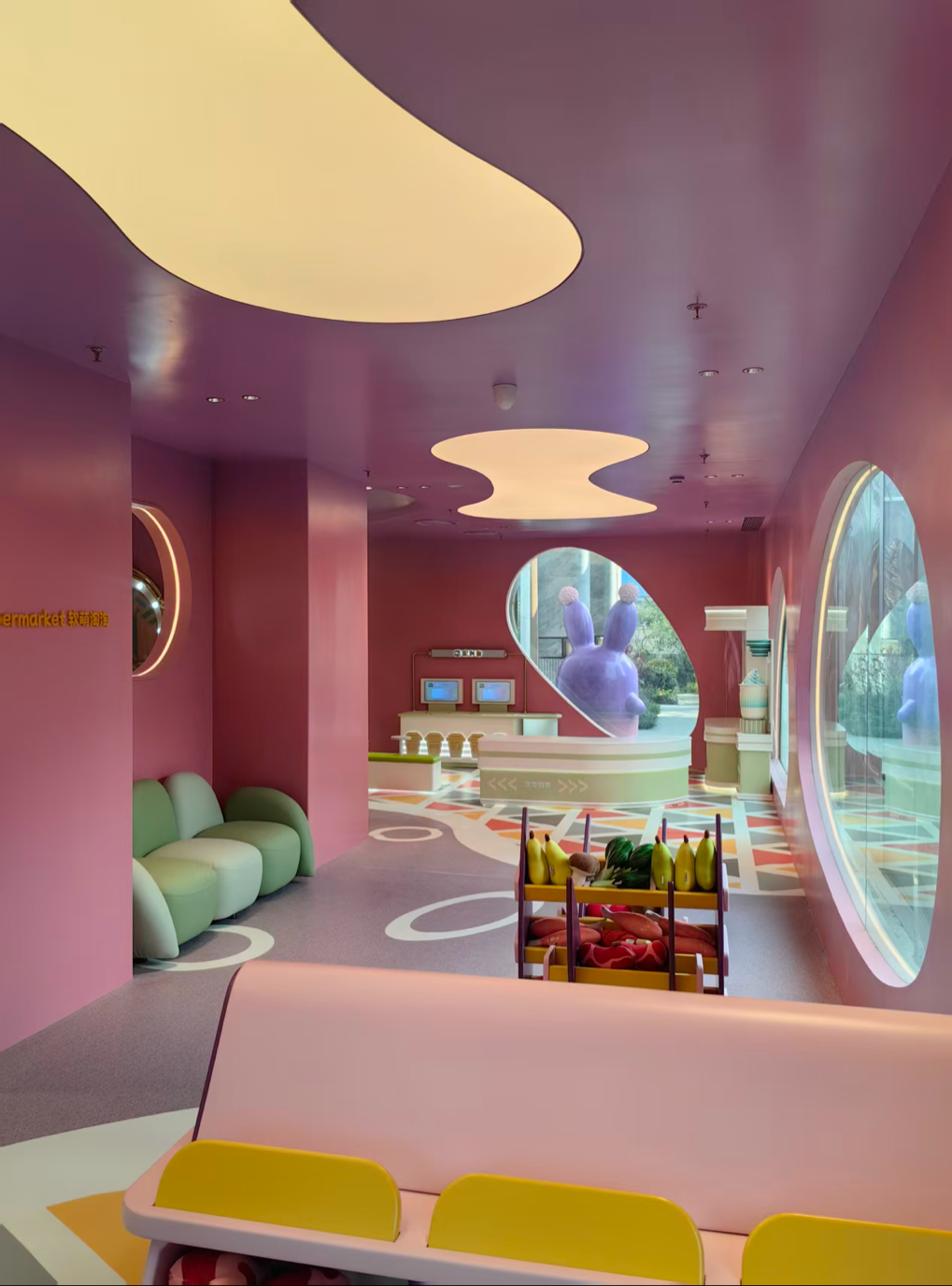 Fantasy family entertainment space with yellow ceiling and soft activity zones