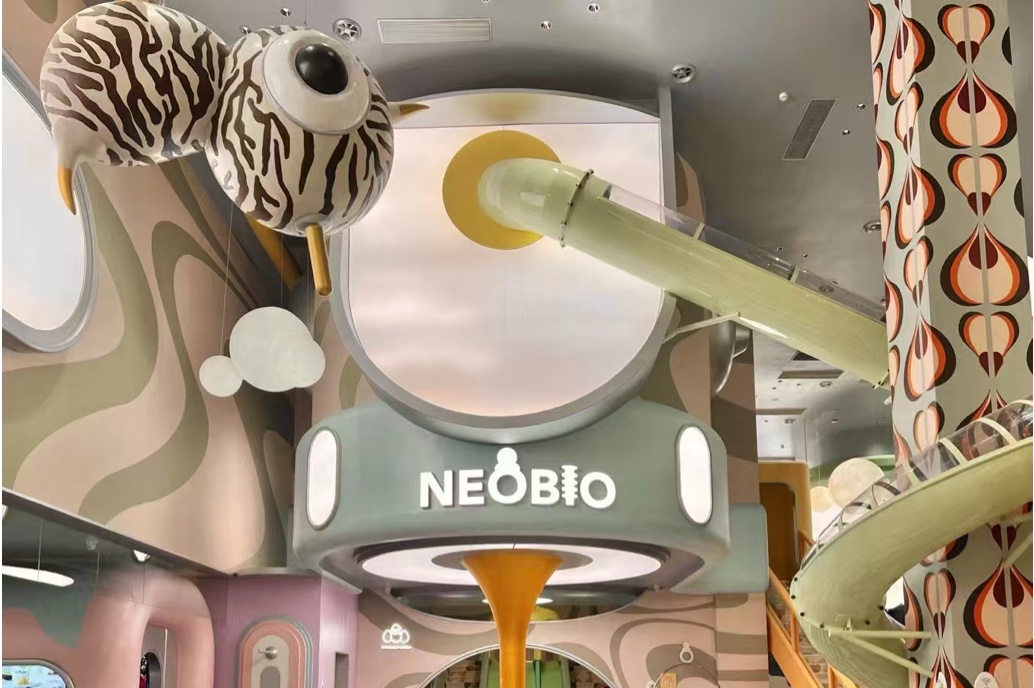 Family retail environment with animal theme and colorful ceiling features