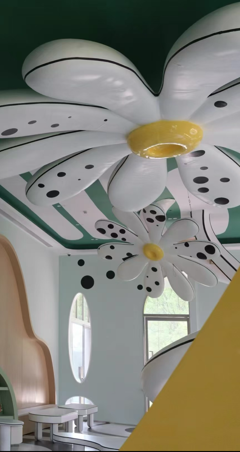 Themed children retail interior with white sculptural ceiling and custom furniture