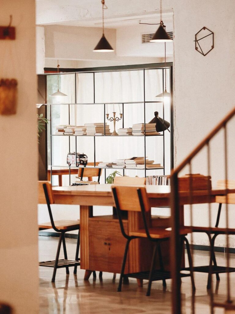 Rustic boutique homestay dining area with wood furniture and natural light