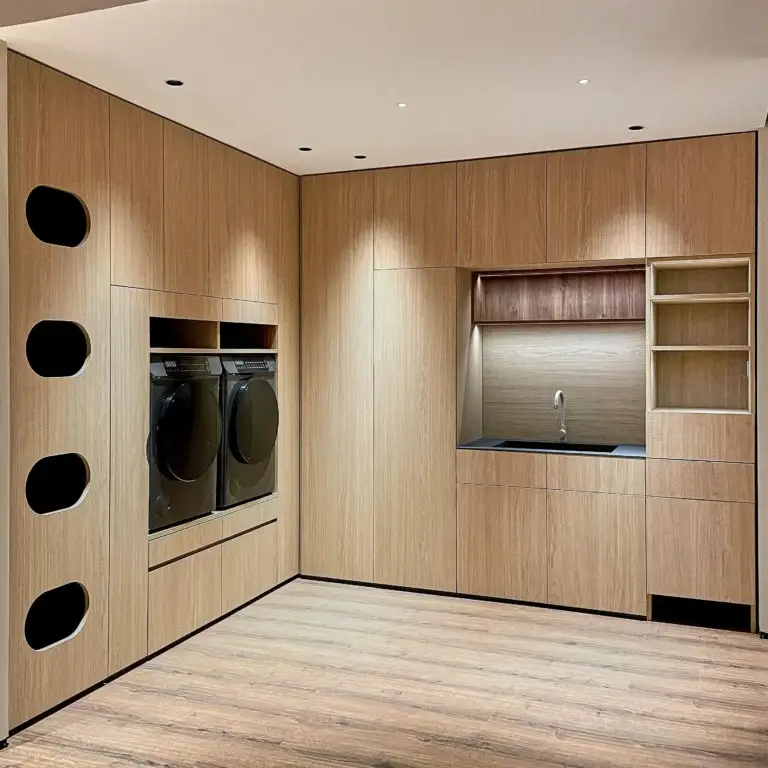 Custom built-in laundry room wood cabinets with storage system